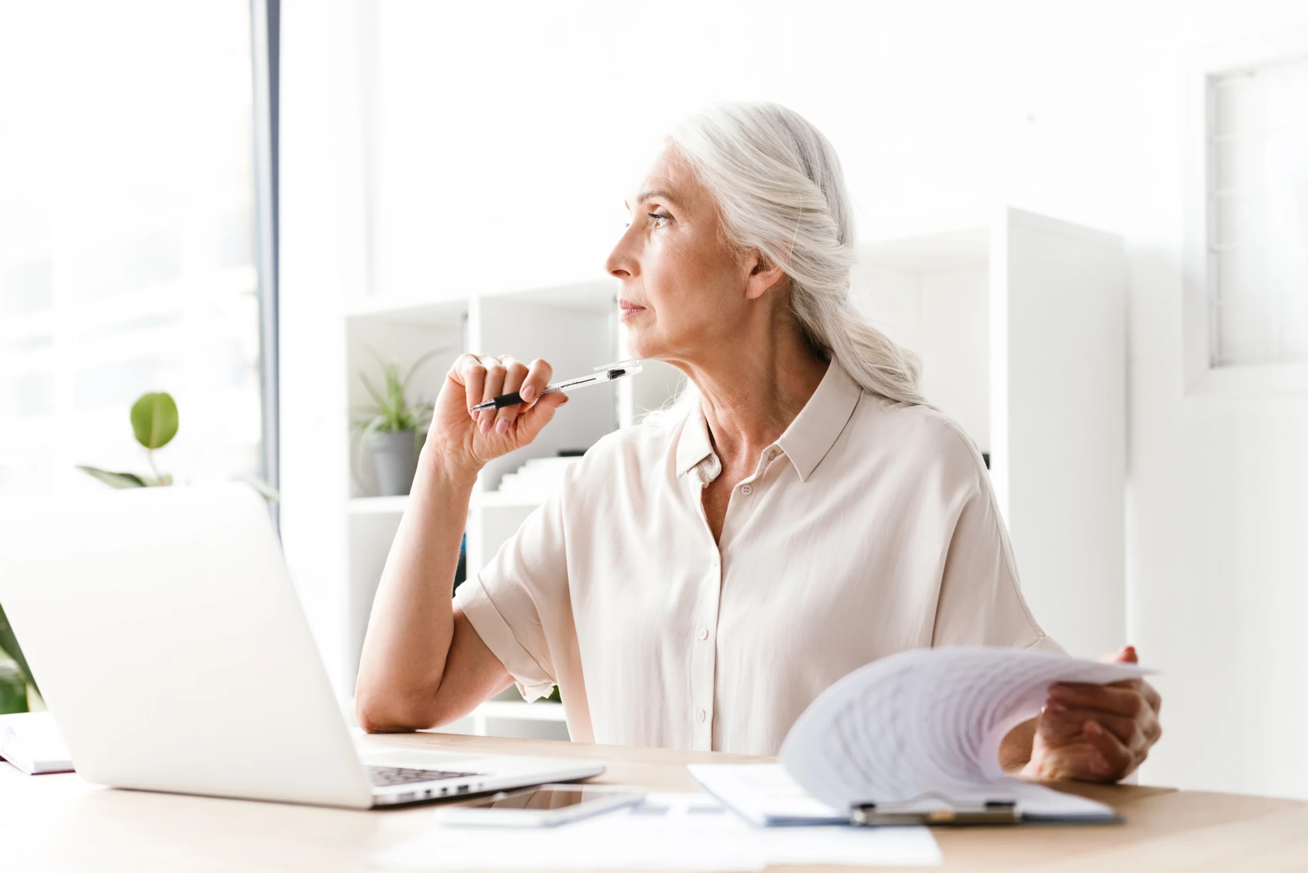 Older woman reviewing Florida estate planning documents at a desk